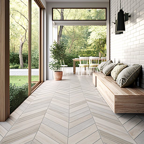 A modern porch with light-colored porcelain tiles arranged in a herringbone pattern