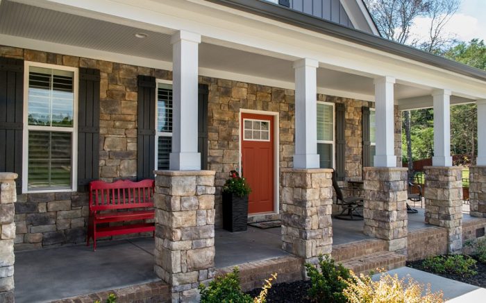 front porch with stone pillars