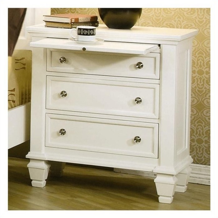 white bedroom set with a slide-out nightstand