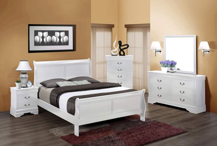 white bedroom set with a slide-out nightstand