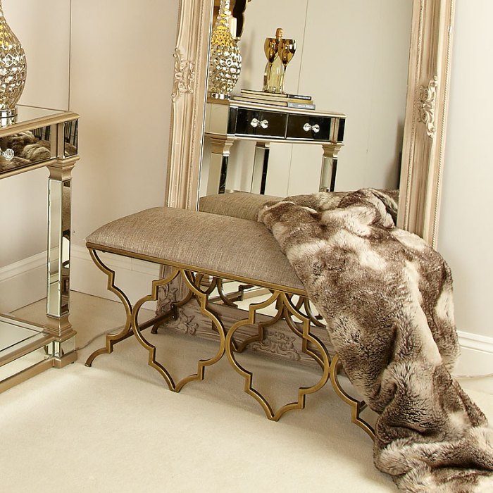 bedroom storage bench with gold accents for glam decor